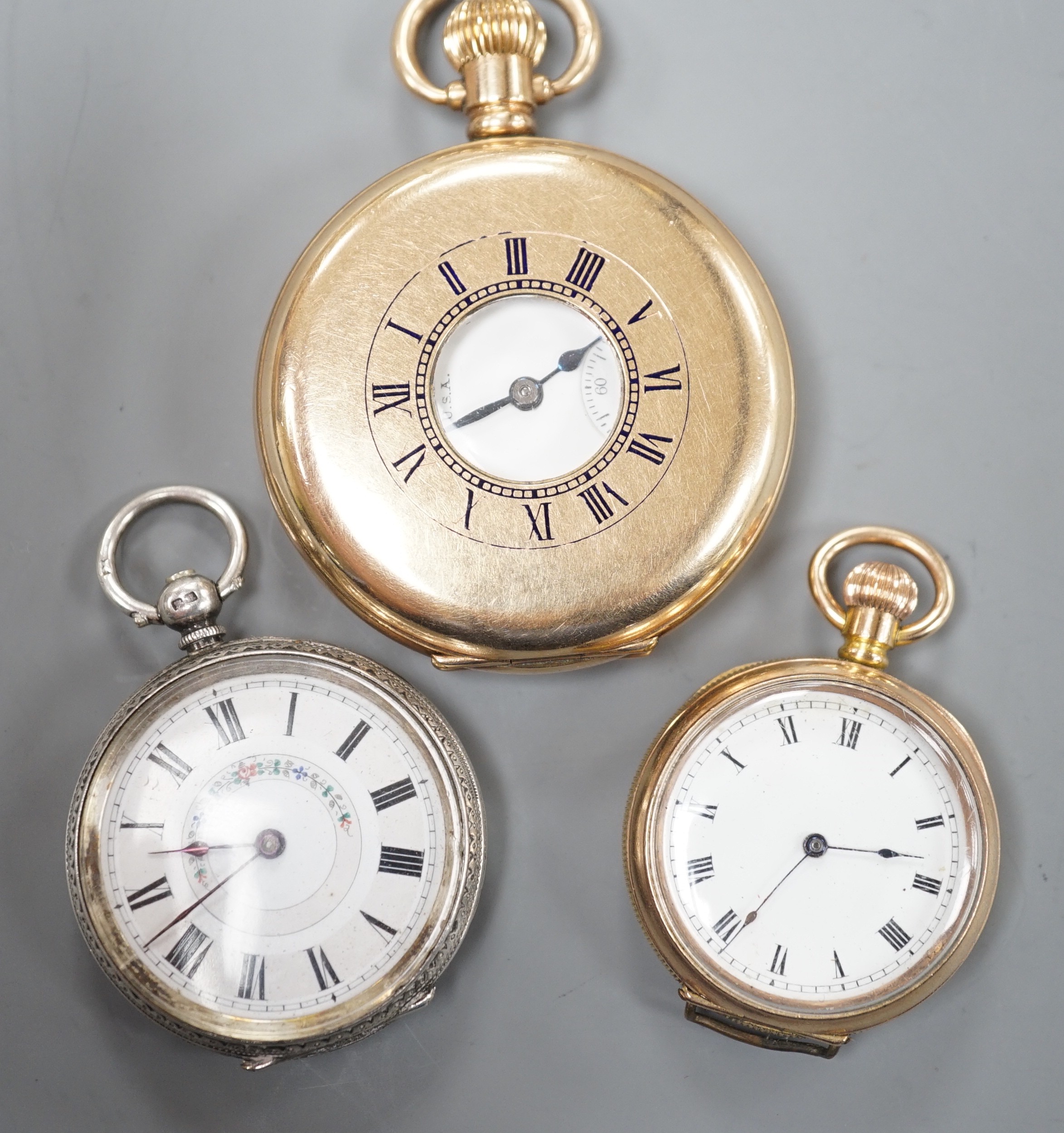 A gold plated Waltham keyless half hunter pocket watch, a George V silver fob watch and a gold plated fob watch.